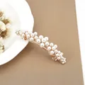 Elegant gold metal hair clip featuring clustered white pearls and a minimalist design - Daisy