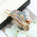 Golden flower hair claw clip with blue and white rhinestones and branch details - Blue Daisy Flower