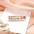 Roségoldene Haarspange mit weißen Perlen und funkelnden HAPPY Buchstaben aus Strass - HAPPY
