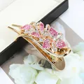 Elegant gold hair clip with sparkling pink and white rhinestones in a floral design - Floral Red