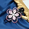Elegante pinza per capelli a fiore nera con strass rosa e centro di cristallo - Rosso