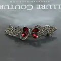 Vintage butterfly hair clip with grey rhinestones and deep red gems in antique silver - Ribbon Red