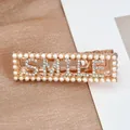 Rose gold duckbill hair clip with crystal SMILE letters and white pearl border - Smile