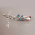 Rose gold alloy hair clip with blue and green rhinestones in a floral wheat design - Double Bow Style / Blue