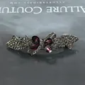 Bow hair clip featuring purple teardrop stones and grey rhinestones in gunmetal finish - Ribbon Purple