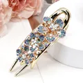 Golden flower hair clip with multi-color rhinestones in blue, green and aurora finish - Begonia Blue