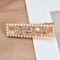 Golden hair clip with pearls and sparkling rhinestone SEXY lettering design - SEXY