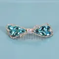 Bow hair clip with blue crystals and white rhinestones on golden metal base - Crystal Style / Blue