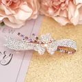 Rose gold bow hair clip with white and purple rhinestones and central heart design - Cymbidium Purple