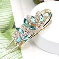 Floral hair claw clip with aqua blue rhinestones on a gold alloy metal base - Cymbidium Blue