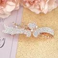 Bow flower hair clip with amber rhinestones and rose gold alloy spring base - Cymbidium Champagne