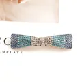 Elegant bow hair clip with blue and white gradient rhinestones on a metal base - Blue Bowknot