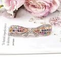 Elegant rose gold bow hair clip featuring a vibrant multi-colored rhinestone pavé design - Bowknot Multicolor