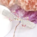Bow-shaped crystal hair clip with colorful rhinestones on a golden metal base - Bowknot Multicolor