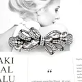 Elegant black alloy bow hair clip featuring sparkling white rhinestones and teardrop crystals - Wisteria White
