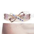 Elegant bow hair clip featuring purple gradient crystals and rose gold spring clip - Ribbon Purple