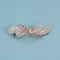 Eleganter Schmetterling-Haarclip in Gold mit weißen und bernsteinfarbenen Strasssteinen - Band-Stil / Champagner