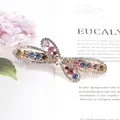 Golden butterfly spring clip with colorful crystals and rhinestones on magazine background - Flying Flower Multicolor (Random)
