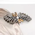Elegant bow hair clip with champagne rhinestones and amber crystal details - Camellia Champagne