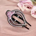 Ethnic style black hair clip with pink crystal rhinestones in a sleek curved pattern - Red
