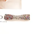 Elegant bow hair clip with colorful rhinestones on a gold-plated spring fastener - Bow knot Multicolor (Random)