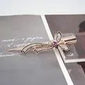 Pince à cheveux papillon or rose avec strass brillants et accents de pierres mauves - Violet