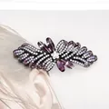Elegant purple crystal flower hair clip with rhinestones and black alloy base for women - Camellia Purple