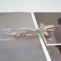 Fermaglio per capelli a farfalla oro rosa con gemme blu e nastro di strass - Blu