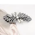 Elegant black alloy bow hair clip with sparkling rhinestones and white marquise gemstones - Camellia White