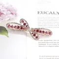 Elegant butterfly hair clip with pink rhinestones and rose gold plating finish - Flying Flower Red