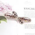 Rose gold butterfly hair clip with sparkling purple crystals and intricate hollow wings - Flying Flower Purple