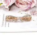 Elegant bow hair clip featuring champagne and white rhinestones on a metallic base - Champagne Bowknot