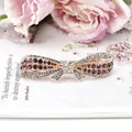 Elegant bow hair clip featuring purple and clear rhinestones on a polished alloy base - Purple Bow