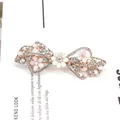 Floral bow hair clip with pink matte flowers and sparkling crystals on light gold base - Butterfly Knot Style / Cherry Blossom Pink