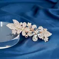 Floral crystal hair clip with sparkling rhinestones on golden metal base and blue silk - Double Flower White