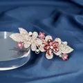 Sparkling crystal flower hair clip with pink rhinestones on a gold metal base - Double Flower Red