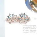 Elegant gold butterfly hair clip with blue crystals and rhinestones in variant finish - Mint Blue Double Butterfly