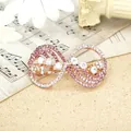 Elegant rose gold infinity hair clip with gradient pink rhinestones and crystals - Scallop Red