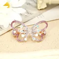 Rose gold butterfly hair claw clip with pink crystals on a vintage background - Butterfly Red