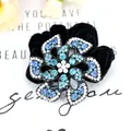 Velvet floral hair scrunchie featuring blue and white gradient rhinestones - Blue
