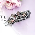 Elegant floral hair claw with sparkling champagne and black crystals for women - Peacock Champagne