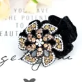 Sparkling crystal flower hair tie with black velvet band and rhinestone details - Champagne