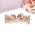 Elegante clip a farfalla in oro rosa con cristalli ambrati e strass scintillanti - Design n. 2 / Champagne