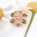 Elegant rose gold flower hair clip with champagne rhinestones for a refined look - Champagne