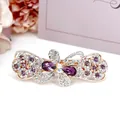 Raffinata molletta a farfalla traforata con cristalli viola e strass luccicanti - Design n. 3 / Viola