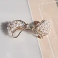 Elegant gold butterfly hair clip featuring white pearls and sparkling crystals - Pearl Bowknot