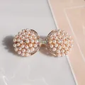 Elegant gold bow hair clip featuring white faux pearls and sparkling crystals - Pearl Scallop
