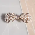 Elegant bow hair clip with pearls and crystal rhinestones on a metal spring base - Pearl Fan