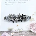 Floral spring clip hair pin with blue glitter petals and black crystals on silver base - Floral Mix