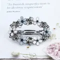 Floral spring hair clip with blue crystals and silver-tone finish on book background - Flower Cluster - Gold